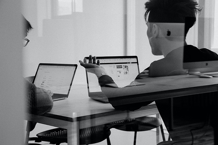 Man working at a laptop.