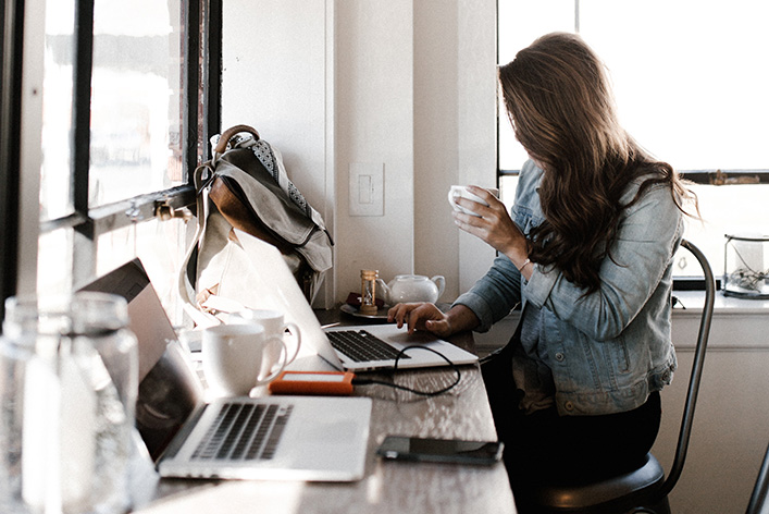 woman marketer working at a laptop