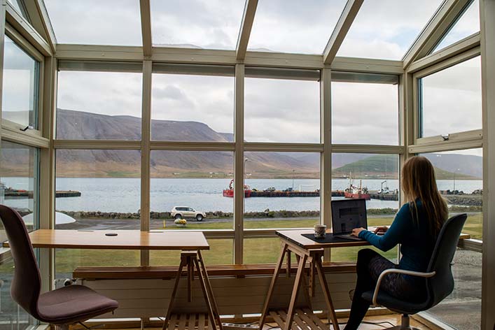 Woman works at laptop with a view | NYTLicensing