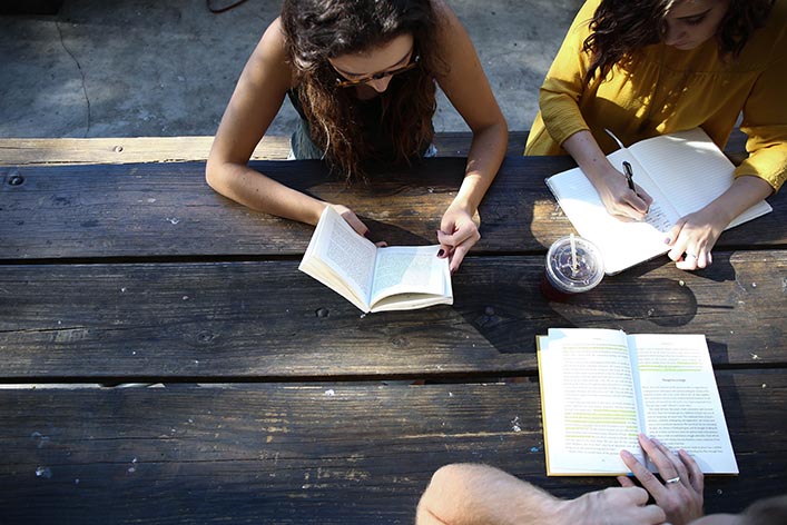 Students study at a table. | NYTLicensing